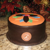 Leather Sac Cake Made this cake for my friend who always travels... and personalized it with an L broach. surprised at how leathery the chocolate fondant...