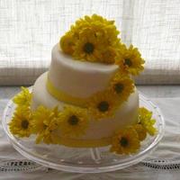 Yellow Daisy Bridal Shower Cake This was my first two tier cake!! i made this for my good friends bridal shower and everyone said it was the best tasting cake they have...