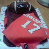 Georgia Cake doctored white cake mix, hershey's cocoa icing. The football is made from rice krispie treats; jersey, letters & emblems are...