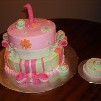 Baby's First Birthday Buggy Cake BC with fondant accents and fondant lady buggy. Small smash cake for the baby.