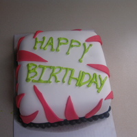 Pink Zebra Cake White cake covered in white fondant with hot pink zebra stripes. Black ball fondant boarder with happy birthday written in lime green BC.