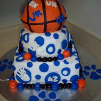 University Of Kentucky three tier red velvet cake, covered in fondant with fondant decorations.