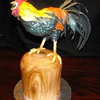Cock-A-Doodle-Doo! Rooster body is RKT covered with fondant/gumpaste feathers. Stump is french vanilla cake covered in fondant.