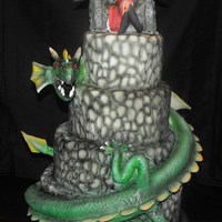 Dark Fairy And Her Pet Covered in fondant, with hand-carved cobblestone. Dragon and fairy throne are RKT covered in gum paste/fondant mix. All details hand...