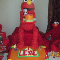 Lexie's 2Nd Birthday Elmo Cake This cake was the most fun yet. I made the Elmo out of rice krispies, fondant and coconut. The cake was covered with buttercream and the...