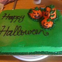 Green Halloween Cake With Pumpkins Hey all!I made this in a hurry with green buttercream, smoothed with viva paper towel (in a hurry, so not perfect), piped words and grass...