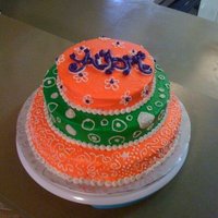 Niece's 1St Bday Cake... This is a three tier strawberry cake, covered in buttercream. It is actually pink and green... not orange. I made a tiara for the topper,...