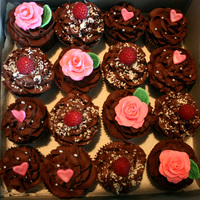 Cupcakes Cupcakes for surprise bridal shower --dark chocolate cupcake with fudge filling topped with whipped dark chocolate ganache. Some are...