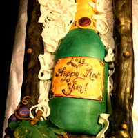 Happy New Year! New Years Cake for my parents!Champagne bottle is strawberry cake filled with whipped white chocolate ganache, strwaberry mousse, and...