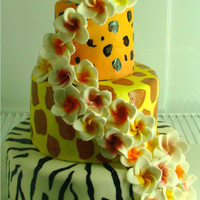 Animal Print Plumeria Birthday Cake hand painted animal print...sugarpaste plumeria flowers with luster dust