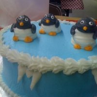 Icy Cold I needed to find something more creative than the Wilton clowns to pipe for my Course 1 cake, so I decided to pipe penguins and it worked...