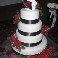 Wedding Cake 4 tiered black and white and red rose wedding cake