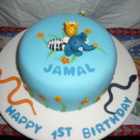 1St Birthday Fondant covered with hand-made animals and elements.