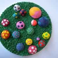 Fantasy Mushroom Glen The mushrooms are made from carved cupcakes and covered in fondant. The grass is piped buttercream.