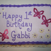 First Birthday Butterflies This is a yellow cake covered in BC. This was a last minute cake order, so I didn't have time to make a batch of fondant or let it set...