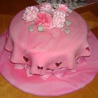 Fondant And Gumpast Class Vanilla Cake with chocolate frosting, MMF over cake w/gumpaste carnation flowers, fondant hearts w/pearl dust.