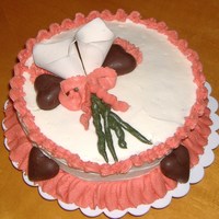 Valentines Cake Chocolate cake w/vanilla carmel buttercream frosting w/ gumpaste Calilies, and chocolate hearts