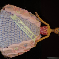 Rebecca's Barbie Cake Made for a 5 year old. She wanted Barbie in pink and purple. White cake with chocolate chips.