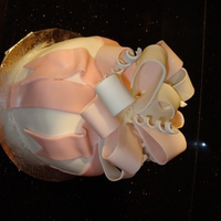 My First Bow Cake Made for my son's teacher's Birthday. As soon as I finished it, my 4 year old walked over and jammed his thumb through the side...