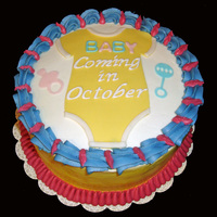 Baby Coming! Made this cake for my sister to announce to the family that she is pregnant. Indydebi's buttercream with fondant accents.
