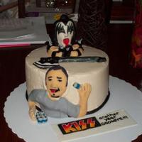 Gene Simmons Kiss Fan Cake This was my second decorated cake ever and I totally blew the proportions of the figures wayyyy out. I made it for my husband's band...