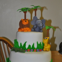 Jungle Cake this is my first tier cake, is my final project for wilton course 3. I made all the animals, first time doing animals also, they are...