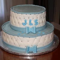 Christening Cake Done in a white quilted fondant with baby blue accents. I thought it was very clean and neat looking for my grandson's christening.