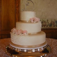 Wedding Cake With Gumpaste Roses Vanilla cake with strawberry buttercream filling, covered in ivory fondant. Gumpaste roses, real ribbon. Bride provided the topper. My 1st...
