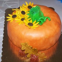 Pumpkin Cake did w/ 2 bundt cakes and 1 round. stem is ice cream cone. all covered in fondant w/ fondant black eyed susans. painted w/ glitter dust,...