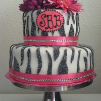 Zebra Print Cake Zebra baby shower cake with sugared zebra stripes and flower accentswww.sugarnspicepatisserie.com
