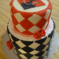 Alice's Cake Checked pattern cake with ribbon roses and dragees. Bottom tier chocolate with oreo filling and top tier chocolate with creamcheese filling...