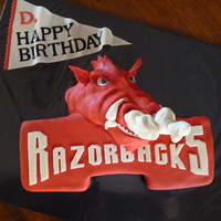 Razorbacks! Razorback red velvet cake with cream cheese icing. All cake with fondant accents. BTW...that's "steam" blowing out his nose...
