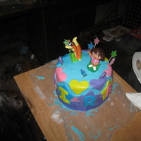 My First Attempt At A Fondant Cake This was my daughters Dora cake. It said her name Sirena around it. It is 3 tiers, bottom and top are strawberry lemonade, and middle if...