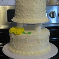 Yellow Rose 50Th Anniversay This was the first 2 tier cake I have made. I think it turned out pretty well. I still have a hard time getting buttercream completely...