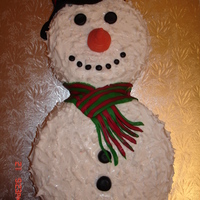 Snowman This was my first attempt at a snowman cake, he is covered in royal icing sprinkled with sparkles and has fondant features