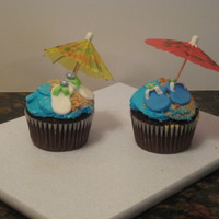 Summer Beach Cupcakes Chocolate cupcakes with vanilla buttercream and fondant sandals and beach balls.