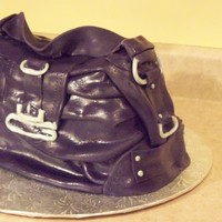 Purple Guess Purse Buttercream frosting - covered with fondant. all details made with fondant.created for a lady who's just going "gaga" for...