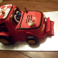 Red Tractor For Kael White vanilla Pound cake with ButterCream frosting. - covered with fondant.Red tractor.. cartoon type for a 2yr special boy.
