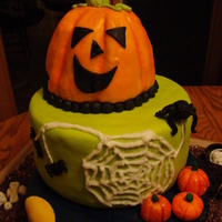 Halloween Cake This is my DDs first attempt at a stacked cake. The pumpkin is carved and covered in homemade fondant. The other two layers are covered in...