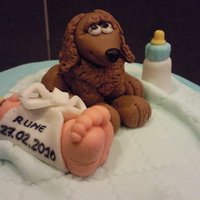 Blue And White Cake For Baby Boy Blue and white cake for baby boy. 2 tier cake with a layer of blocks (no cake).