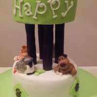 Animals Under A Tree Birthday cake for my vet. The animals on the cake are a cat, a rabbit, a parrot and a dog.