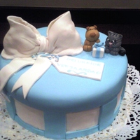Gift Box Cake Blue and white gift box with large white bow and Lucie the sharpei