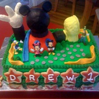 Mickey Clubhouse Mickey Clubhouse cake done for a friend. Chocolate cake with buttercream. Clubhouse is made from RKT coated in buttercream and covered in...