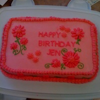 Jen's Pink Birthday Cake My co-worker Jen wanted a cake...to be pink, pink and pink. So here it is. It is a vanilla cake that I tinted pink with buttercream...