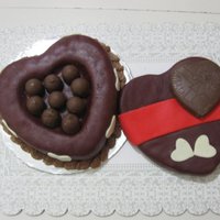 Valentine's Candy Box Cake Double chocolate cake, strawberry/chocolate filling, homemake chocolate fondant,, chocolate buttercream and white chocolate hearts