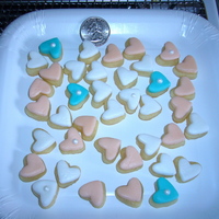 Bite Size Beauties! Valentine Cookies Used the fondant mini heart cut out for sugar cookies. After they came out of the oven I put a cut out of MMF on top. Yummy and bite size....