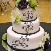 Fondant And Black Swirlies Fondant cake I made for my cousin's wedding. Floral and everything! Thanks for looking :) i really do appreciate it!