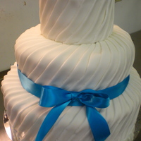 Funky Fondant I made this cake with strips of fondant, my boss lovingly called this "the tire track cake" but I thought it was cute :) tfl!