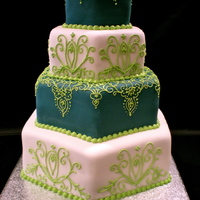 Blue And Green Hexagon Cake I made this cake with fondant and royal icing. All of the piping is done free hand. The bride had a peacock color themed wedding. Very...