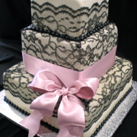 Sexy Black Lace With A Cute Pink Ribbon! I made this cake with fondant and real black lace and ribbon. The bride chose some fun colors, I was pretty happy with the way it turned...